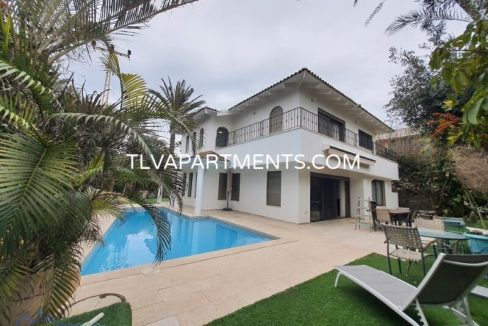 A villa near the beach with a pool